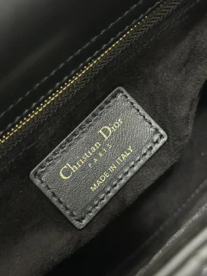 Christian Dior handbag interior label black leather gold lettering made in Italy on suede lining