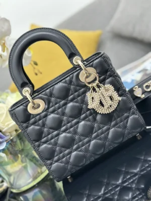 Dior Lady Dior small black quilted lambskin leather handbag with gold-tone hardware and charms