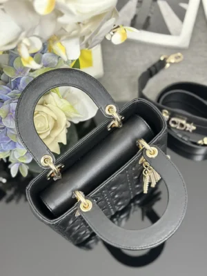 Dior Lady Dior small black leather handbag gold hardware and detachable logo strap