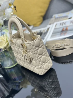 Dior Lady Dior small quilted leather handbag beige gold-tone hardware with charms