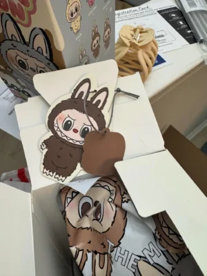 Medicom Toy BE@RBRICK The Monster 1000% brown vinyl collectible figure with character tag and packaging box