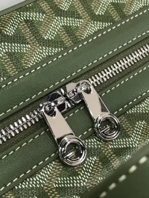 Goyard Cisalpin Backpack zipper detail featuring dual silver-tone zippers on green Goyardine canvas with structured design.