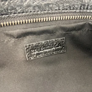 Interior view of the Balenciaga Le City Horizontal Motorcycle Bag showing the brand label and zipper detail.