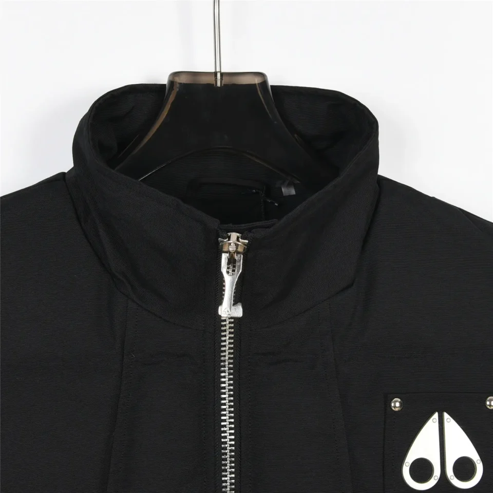 Moose Knuckles bomber jacket black nylon fabric with silver zipper and metal logo emblem