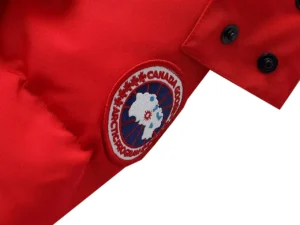Canada Goose Expedition red jacket nylon fabric with embroidered Arctic Program patch and black snap buttons