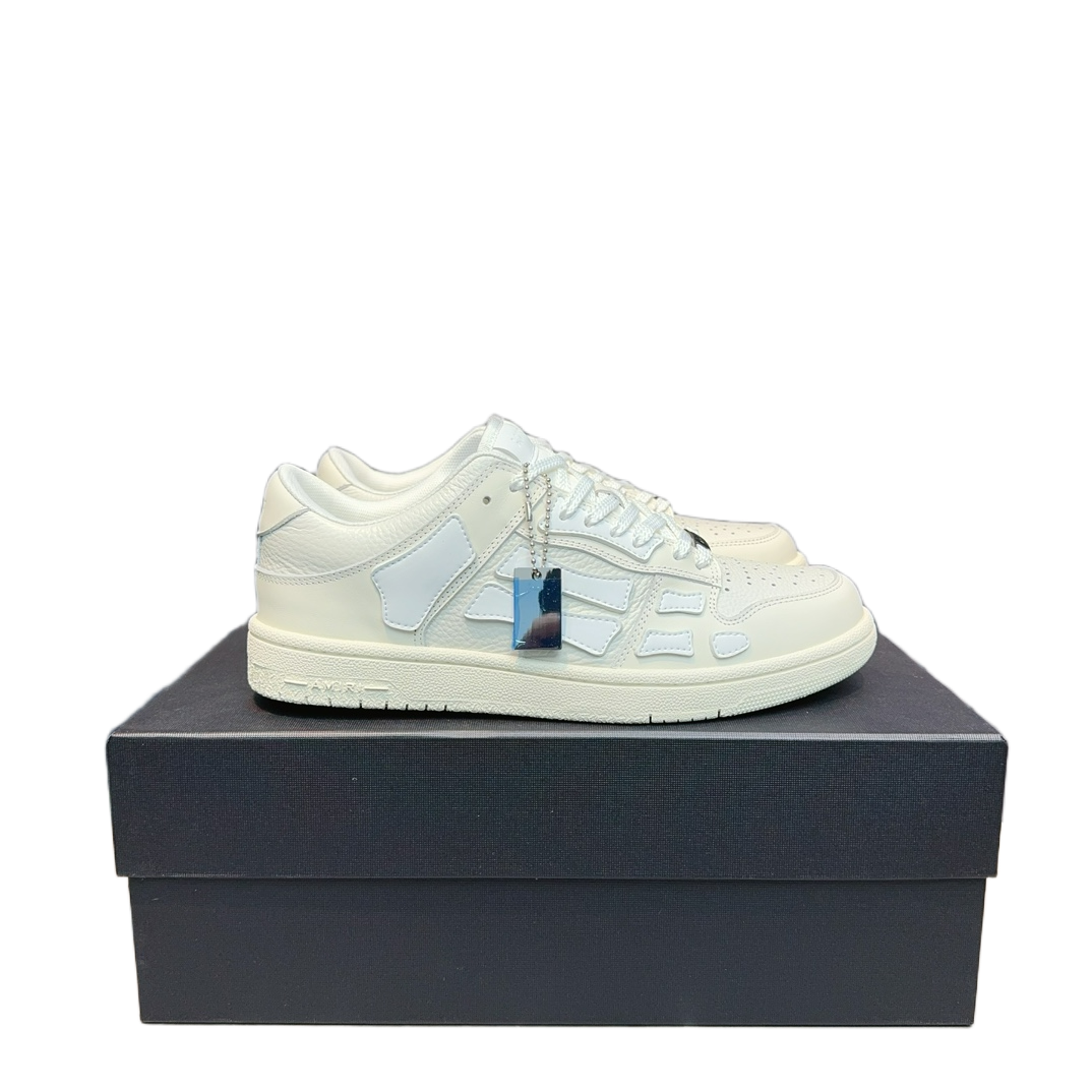 Axel Arigato Clean 90 off-white leather sneakers with textured paneling and lace-up design