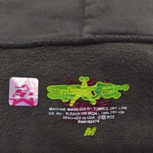 Staple Spider tag black cotton t-shirt with green yellow graphic and red web design