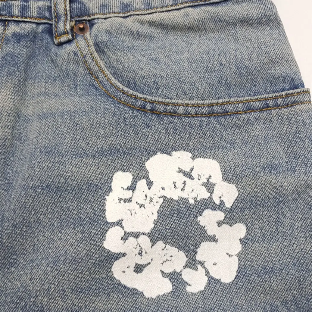 Repsgoat denim jeans light blue cotton with white graphic paint detail near pocket