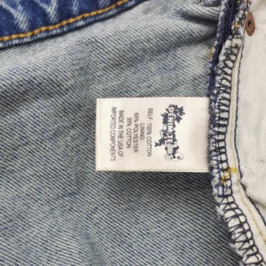 Denim Tears denim jeans light blue cotton polyester blend made in USA with imported components label