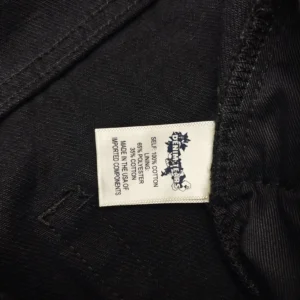 Denim Tears clothing tag black cotton fabric 65% polyester 35% cotton made in USA with imported components