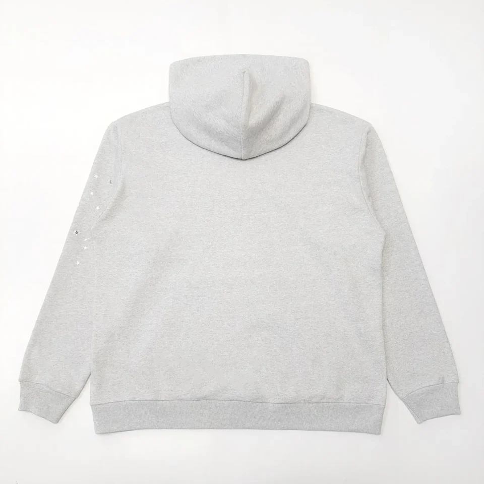 No brand or specific product type is provided in the image, it is a plain gray hoodie with a subtle star design on the left sleeve made of cotton material