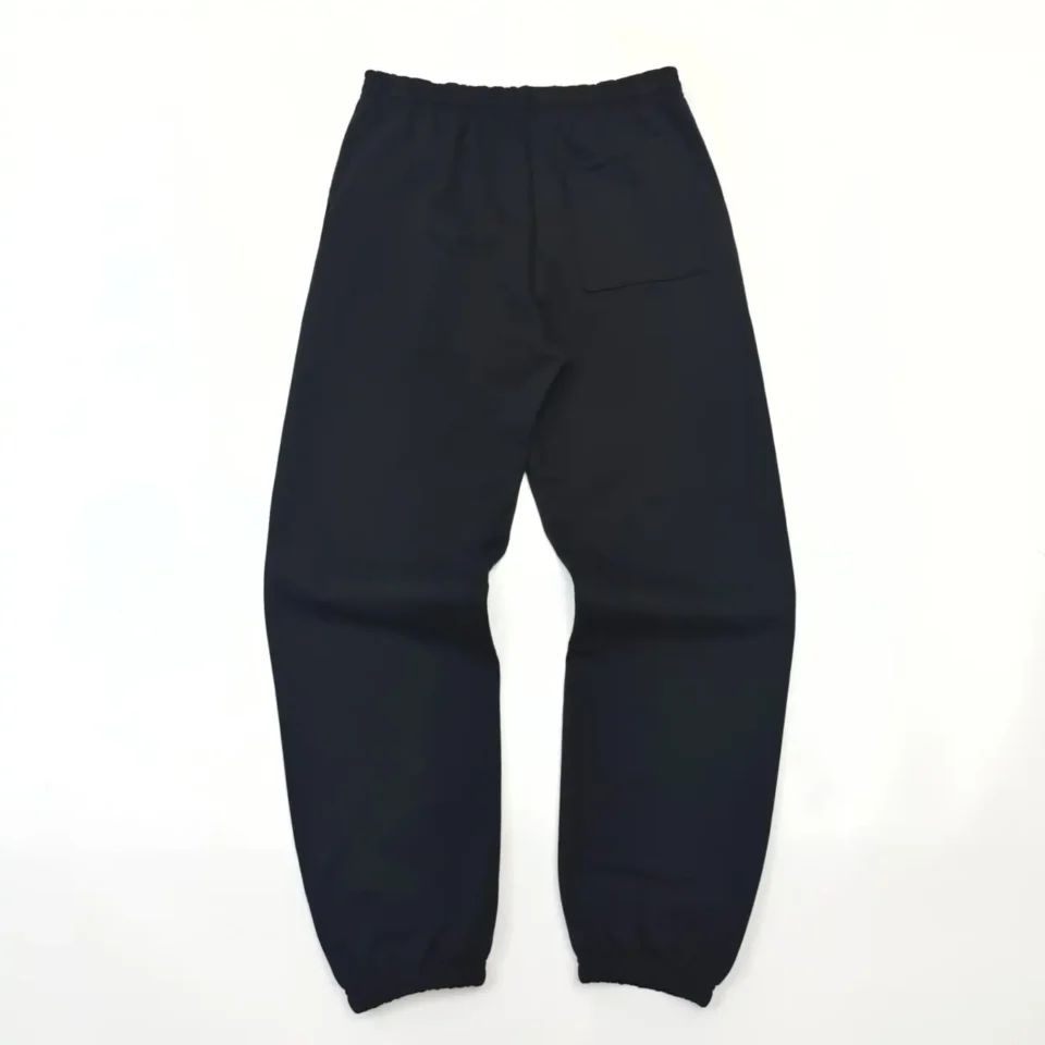 No brand visible black sweatpants with elastic cuffs and back pocket cotton material