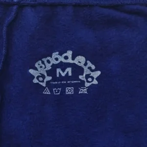 A Bathing Ape blue fleece fabric with white printed brand name and care symbols in size medium
