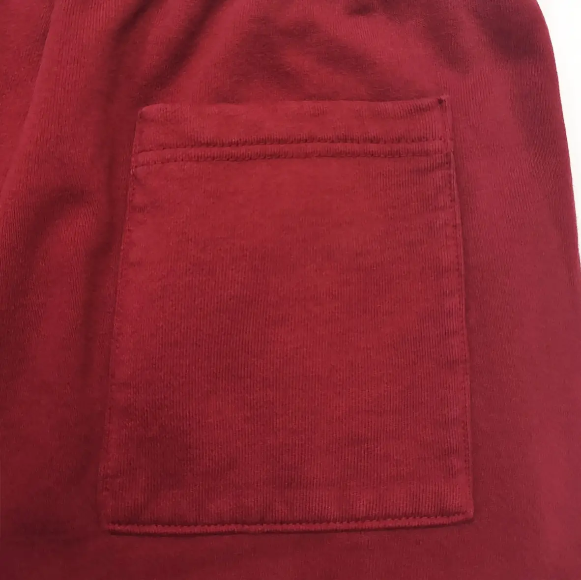 Repsgoat corduroy pocket fabric maroon cotton material close-up detail