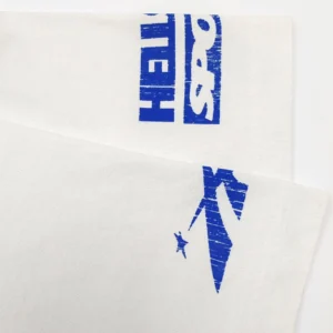 Hellstar Blue BEAT White Short Sleeve t-shirt featuring bold blue logo and design elements on a white fabric background.