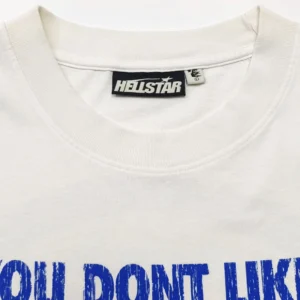 Hellstar Blue BEAT White Short Sleeve t-shirt featuring bold blue text "YOU DONT LIKE" and a close-up view of the collar and brand tag.