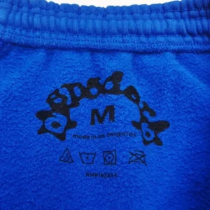 Dopada Sweatpants Medium size blue fleece with printed logo and care symbols