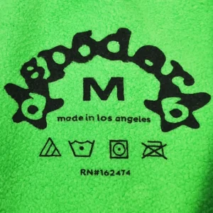 Repsgoat green fabric clothing label with black logo and care symbols made in Los Angeles size M