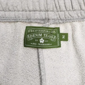 Denim Tears clothing label green fabric tag white cotton garment medium size made in USA