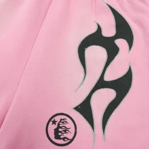 No brand or model visible on the pink fabric with black flame and star logo accessory