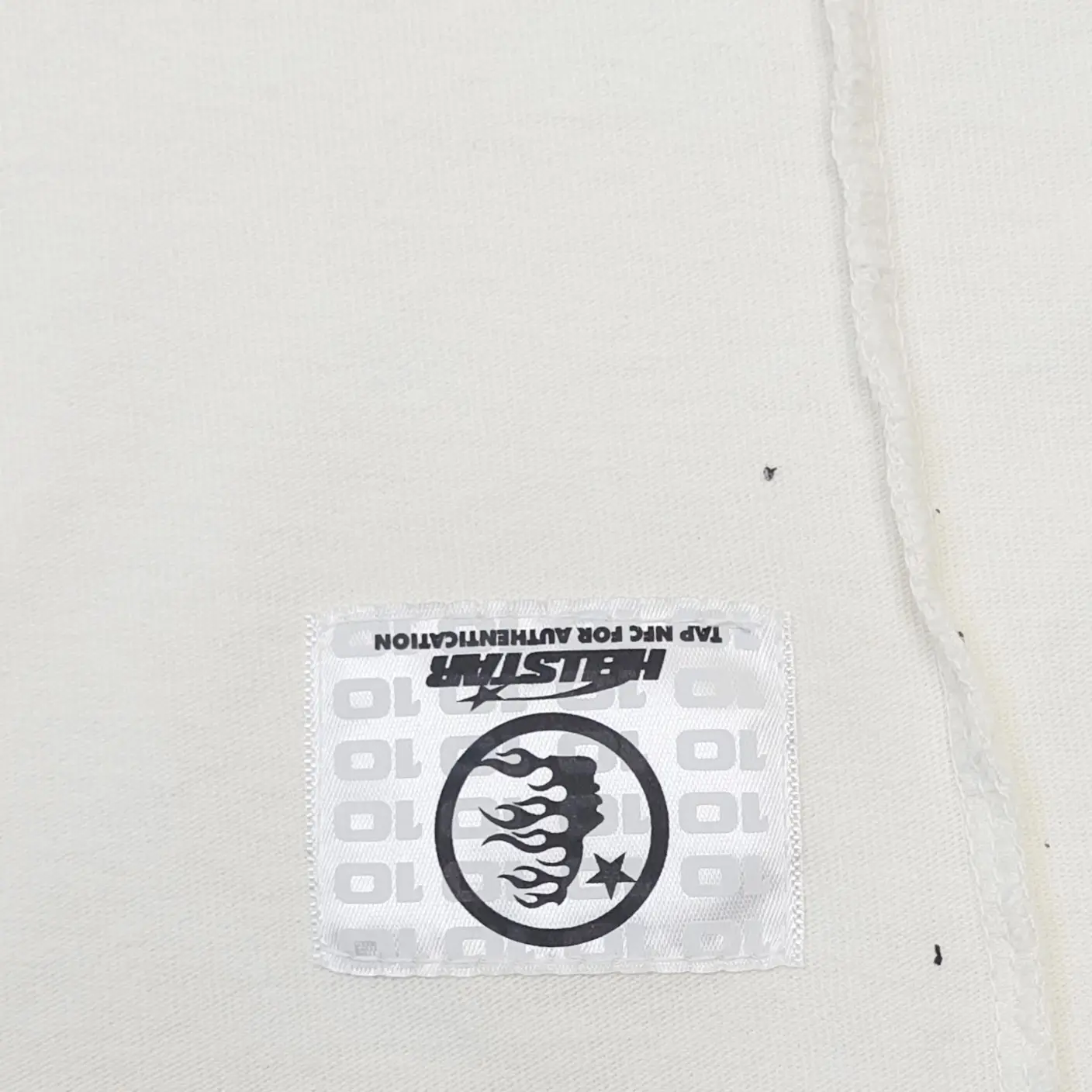 Halstar clothing white patch with black logo and flame design on cotton fabric