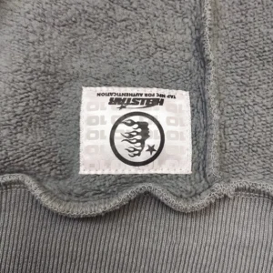 Helstar clothing label gray fleece fabric premium texture with brand logo and authenticity tag