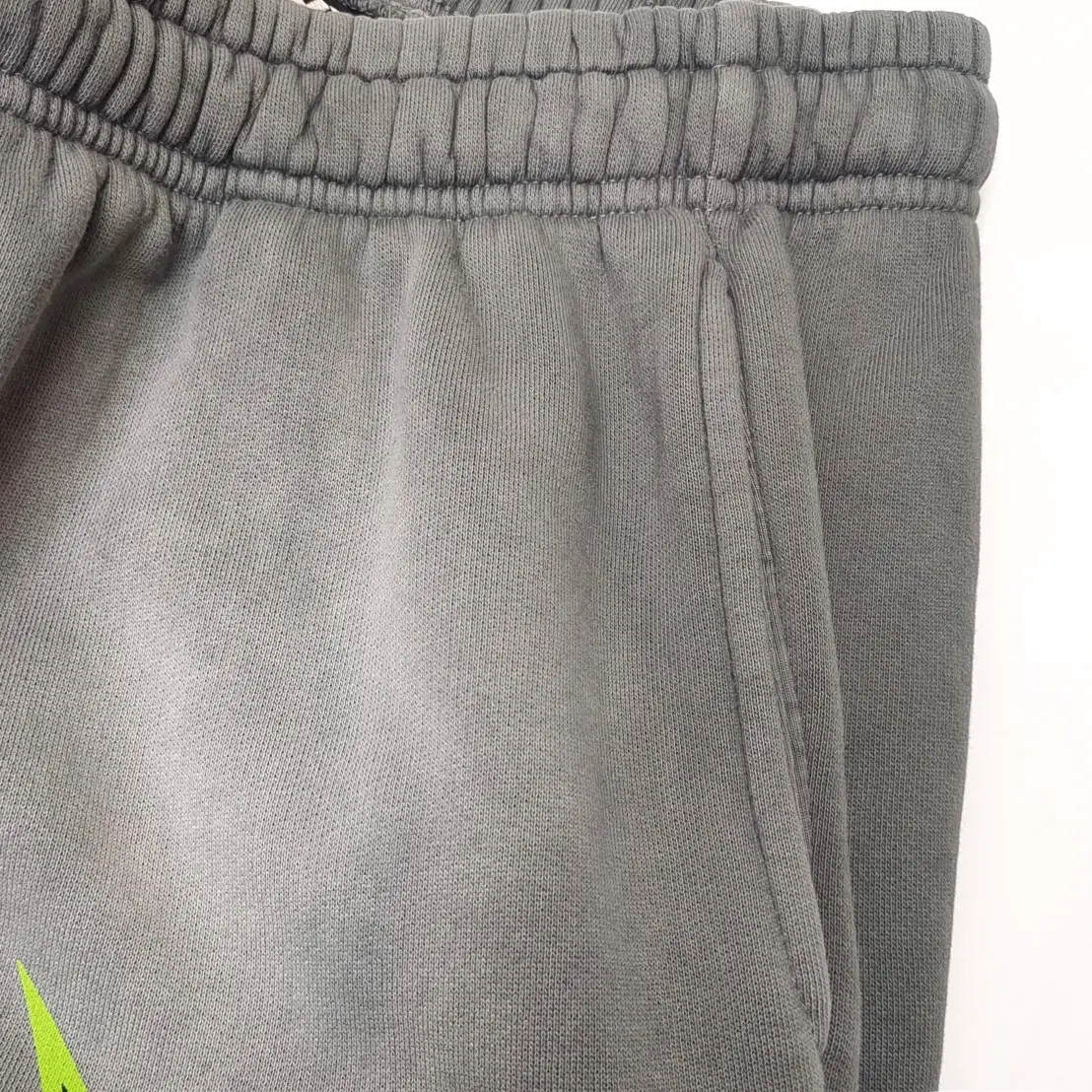 Nike sweatpants style DD1647-067 grey color cotton blend fabric with elastic waistband and side pockets