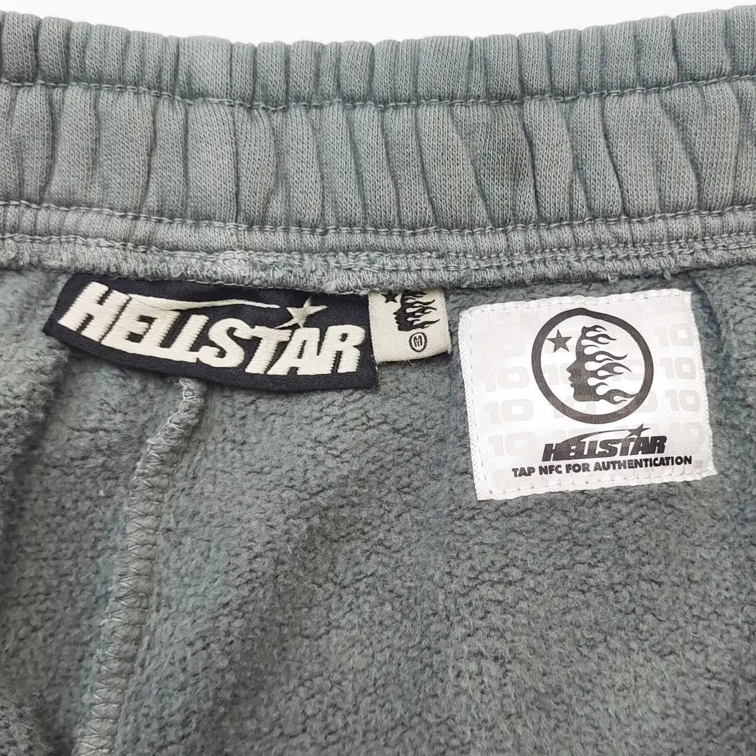 Hellstar fleece sweatpants medium grey color soft warm material with elastic waistband and logo tags