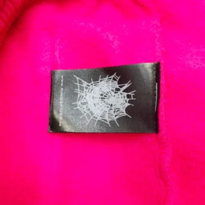 Kaws x Vans fleece jacket bright pink polyester fabric with spiderweb logo tag