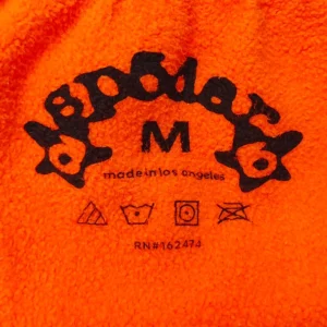 Bape hoodie medium size bright orange fleece fabric with black logo and care symbols printed inside