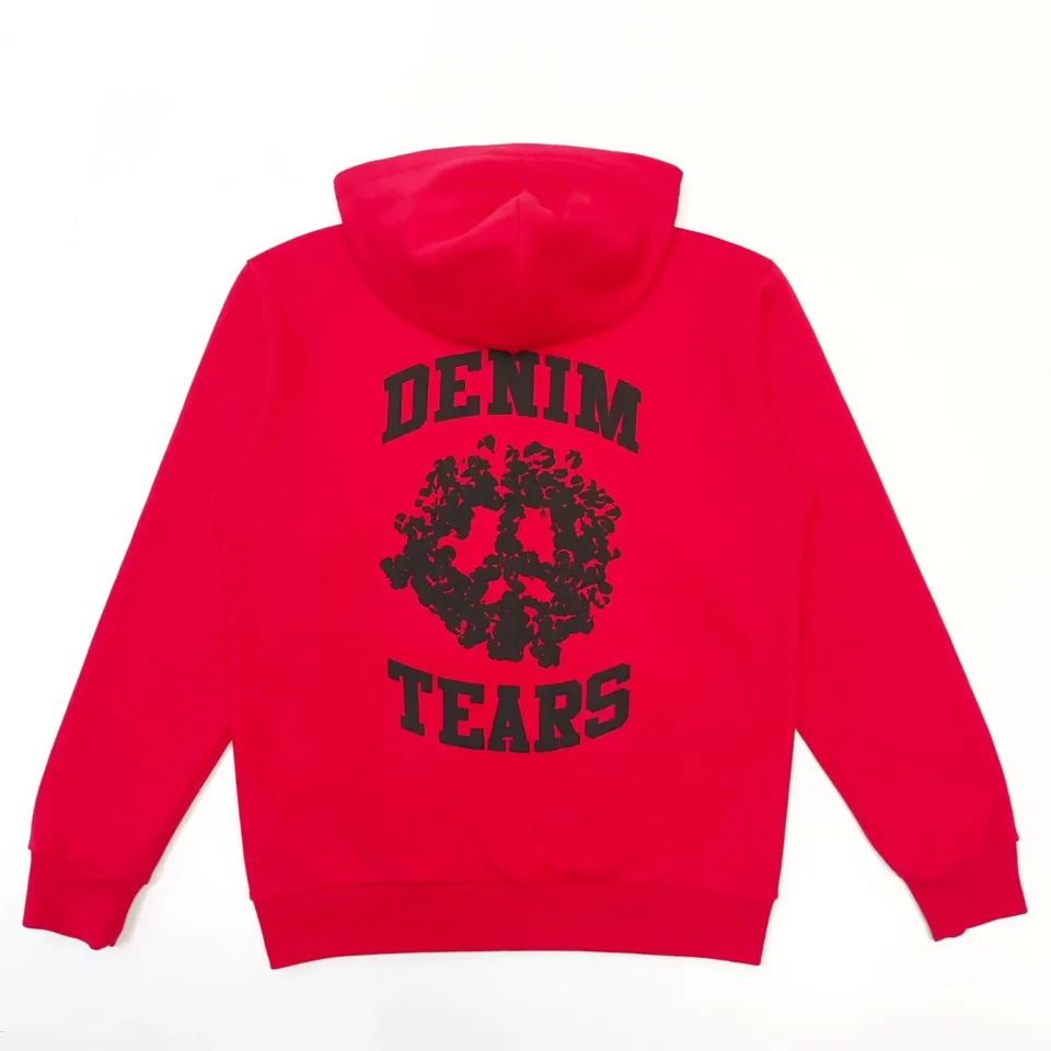 Denim Tears hoodie red cotton blend pullover with black floral peace sign and logo print on back