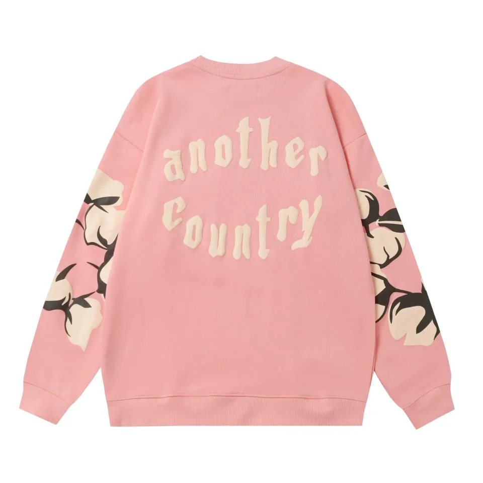Another Country sweatshirt pink cotton with graphic floral sleeves and embossed text on back