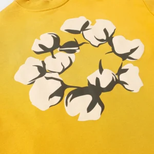 No brand visible yellow cotton t-shirt with white and black cotton flower graphic design