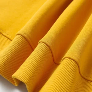 Repsgoat sweatshirt yellow cotton fabric ribbed cuffs close-up texture