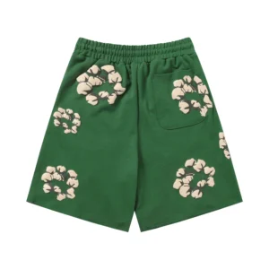 Green shorts featuring cotton flower designs, part of Denim Tears New Cotton Flowers collection, available in various sizes.