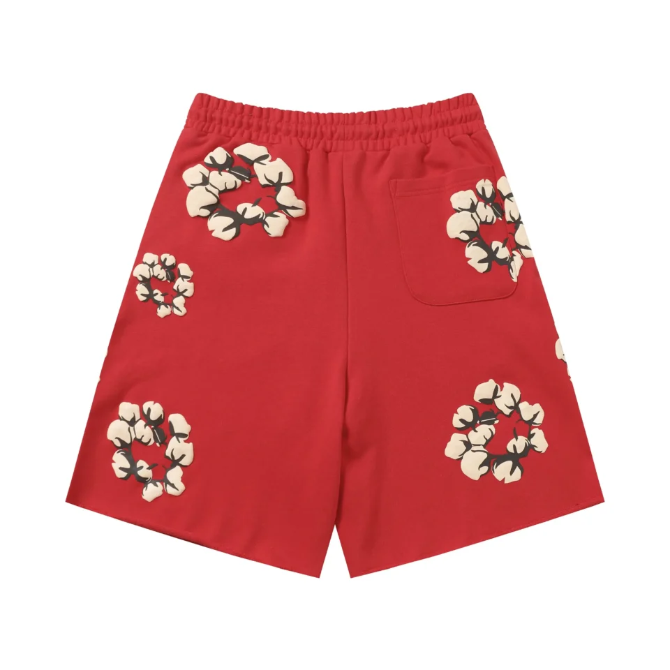 The image shows red shorts with a cotton flower pattern, but no brand or model details are visible for SEO optimization. Please provide brand and model information.