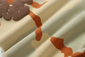 RepsGoat cotton fabric beige orange printed material close-up textured textile details