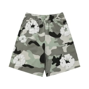 Denim Tears Cotton Flower camouflage shorts featuring floral appliqués, available in various sizes.