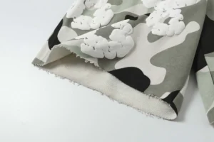 Denim Tears Cotton Flower camouflage shorts featuring foam flocking details and a frayed hem, showcasing high-quality fabric and design.