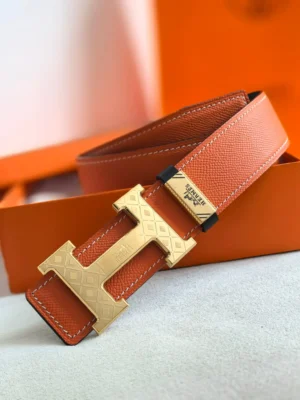 Hermes leather belt orange textured leather gold engraved H buckle accessory