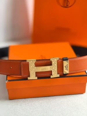 Hermes belt orange leather gold tone engraved H buckle accessory