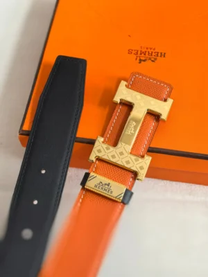 Hermes belt orange black leather gold plated H buckle accessory with embossed pattern and stitched edges