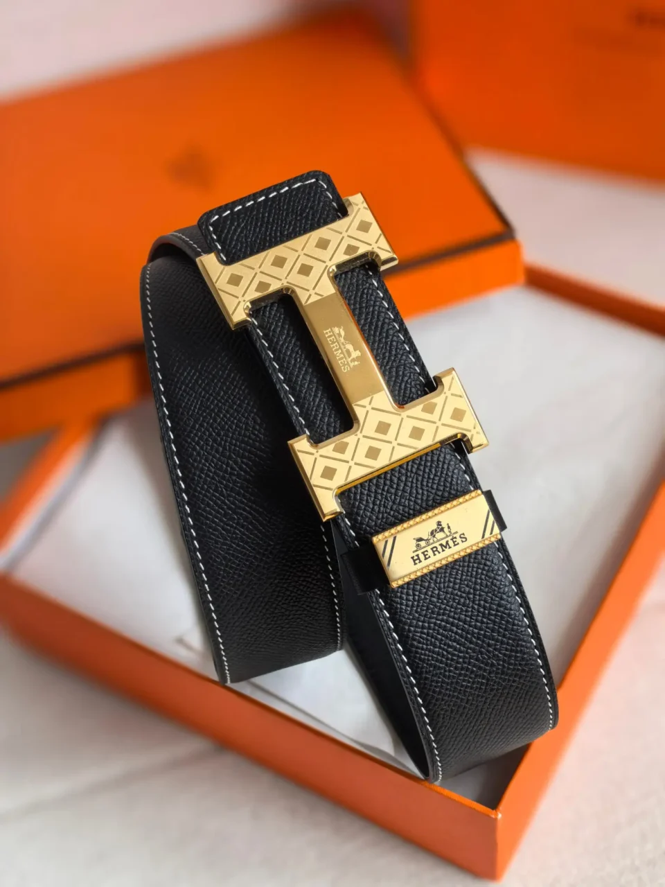 Hermes belt black leather gold tone geometric H buckle with white stitching detail accessory