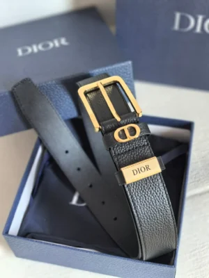 Dior Unisex CD Logo Leather Belt in a blue box, featuring a gold buckle with the iconic “CD” logo and engraved “DIOR” tag, showcasing luxury craftsmanship and style.