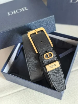 Dior Unisex CD Logo Leather Belt in black leather with gold hardware buckle, displayed in a branded box, highlighting luxury fashion accessory features.