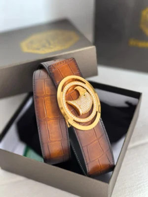 Luxury Stefano Ricci men's leather belt with a gold buckle, displayed in an elegant box, showcasing exquisite craftsmanship and design.