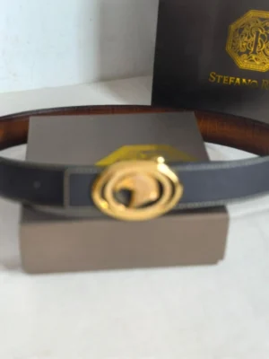 Stefano Ricci luxury leather belt with gold logo buckle displayed on a box, emphasizing high-end craftsmanship and design.