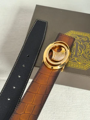 Luxury Stefano Ricci men's leather belt featuring a crocodile-patterned brown strap and a gold-tone buckle with diamond accents, displayed on a branded box.