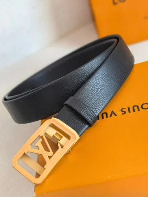 Louis Vuitton men’s automatic buckle leather belt featuring a textured black strap and iconic gold LV logo buckle, displayed on an orange box.
