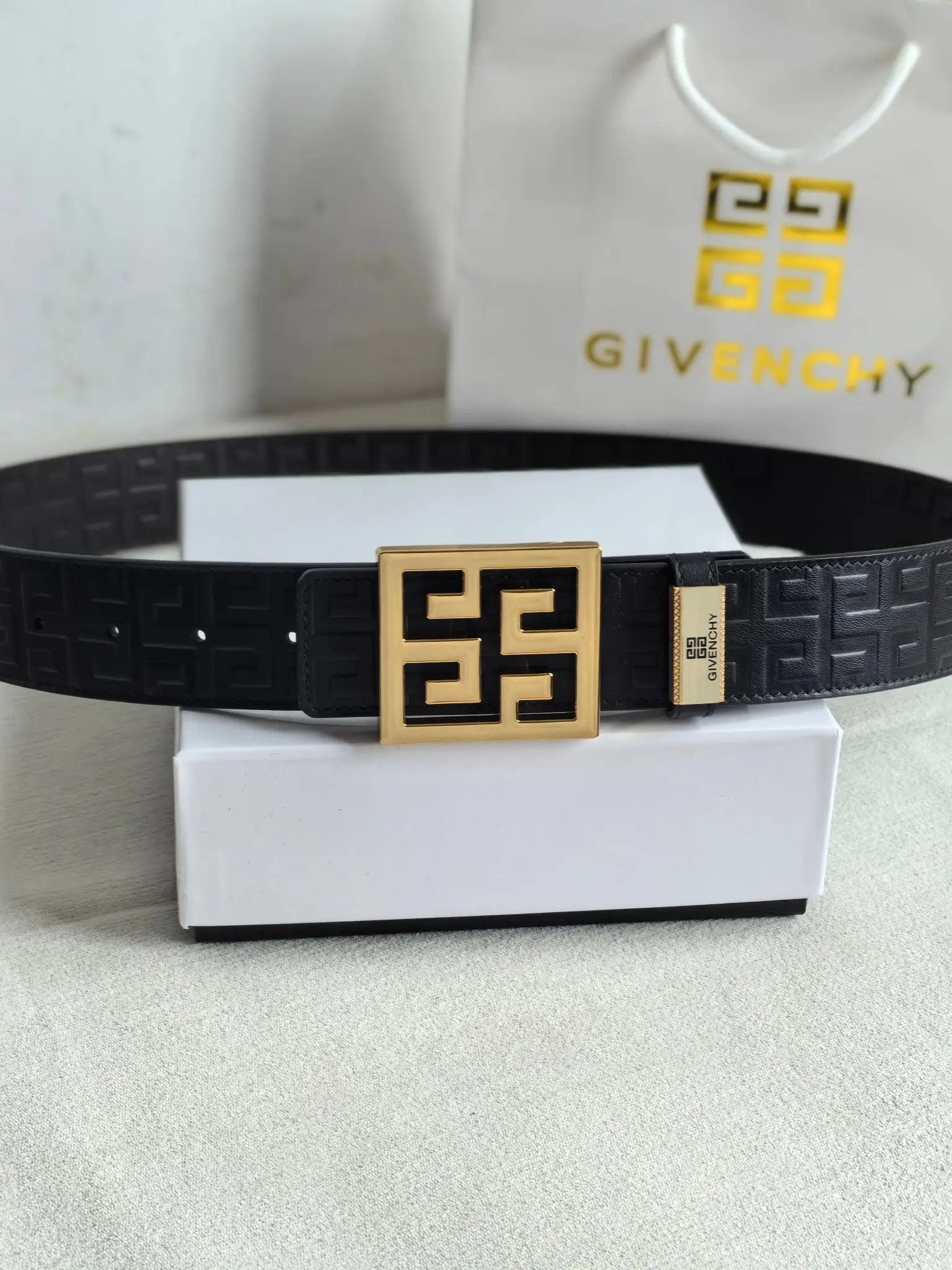 Givenchy belt black leather gold-tone logo buckle embossed pattern accessory